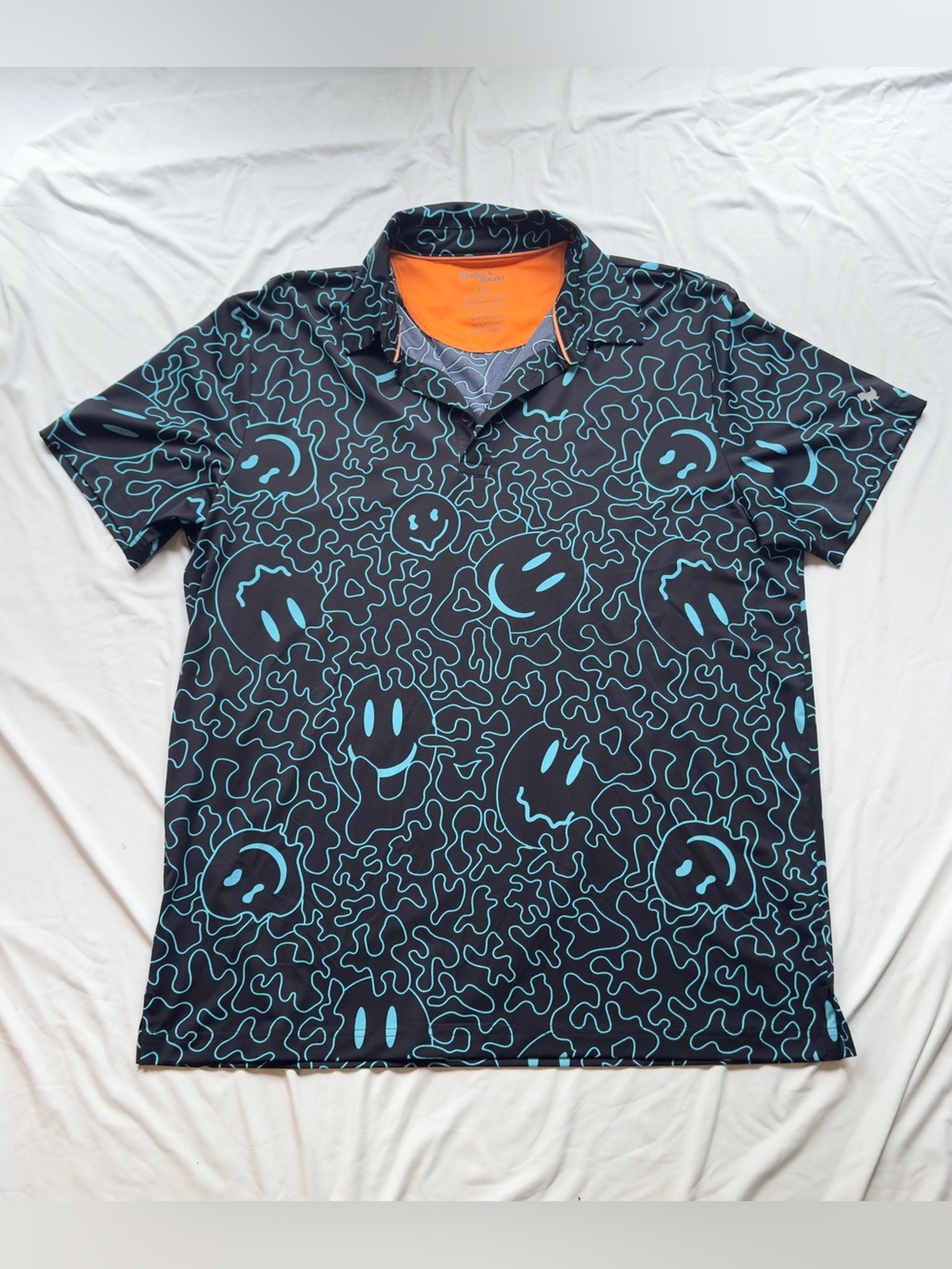 BIRDIEBOUND Black Polo with Teal Smiley Pattern and Orange Interior